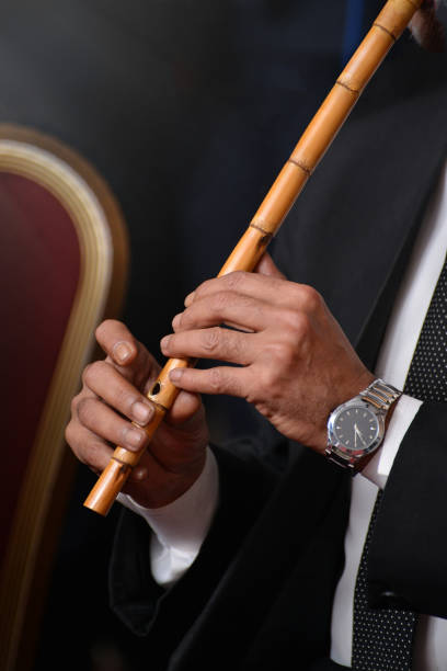 Musician Performing with Arabic Ney During Concert